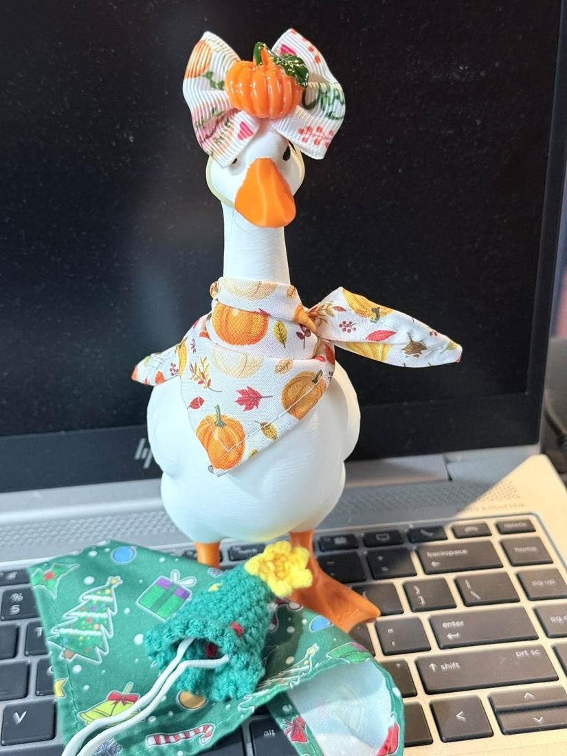 Desk goose in a fall pumpkin bow and scarf