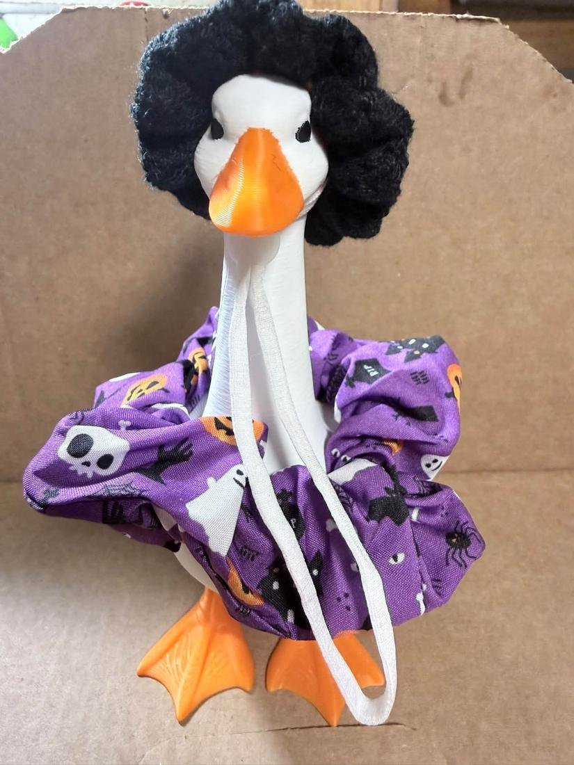 Desk goose in a purple Halloween dress